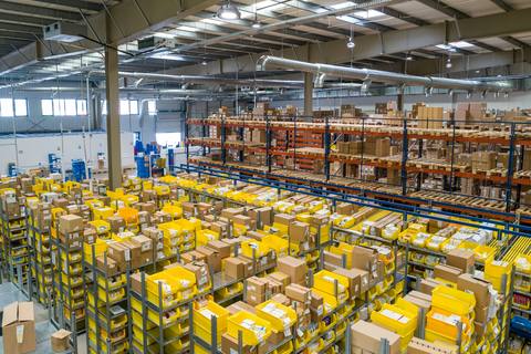 Large warehouse with organised racking and storage