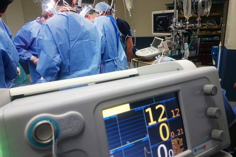 Healthcare operating theatre with surgical team